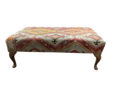 A rectangular footstool with Kilim upholstered seat, width 110cm, depth 63cm, height 40cm