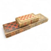 Three folding chess and backgammon boards in the form of books, 42cm