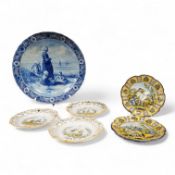 A Delft charger after Artz, together with other faience and majolica dishes, largest 41cm