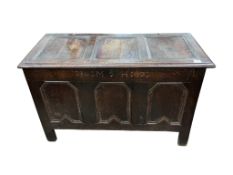 A late 17th century panelled oak coffer, dated 1686, width 116cm, depth 54cm, height 71cm