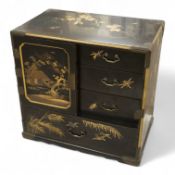 A Chinese export lacquered table cabinet with fitted interior, lacking door, 32cm high