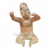 A terracotta pre-Columbian style warrior, over 60 years old, 34cm high