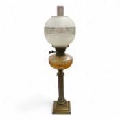 A brass oil lamp with columnar base and etched glass shade, 72cm high overall
