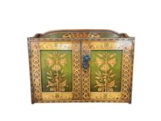 An Art Nouveau poker work two door wall cabinet, width 61cm, depth 21cm, height 52cm