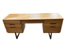 A mid century Uniflex teak kneehole dressing table, width 152cm, depth 46cm, height 71cm