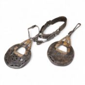 A pair of Argentinian Gaucho leather and piqué work stirrups together with a similar brass mounted