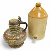 A German earthenware flagon, 32cm tall, together with a Beard & Co of Lewes stoneware liqueur flask