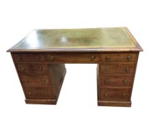 A Victorian faded mahogany kneehole desk with leather inset top, width 127cm, depth 71cm, height