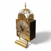 A large lantern style wall clock, 60cm high