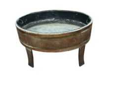 A George III brass bound staved mahogany oval wine cooler, width 92cm, depth 65cm, height 56cm