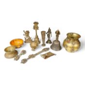 A group of Tibetan brass and mixed metal artefacts to include a brass vase with cabochon inset