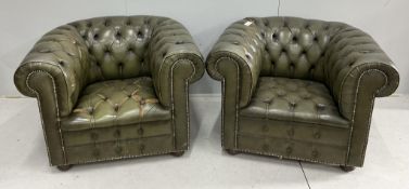 A pair of Chesterfield style buttoned green leather club armchairs, width 104cm, depth 92cm,