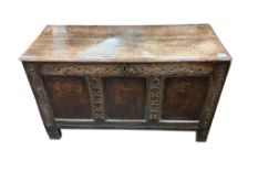 An 18th century panelled oak coffer, width 111cm, depth 48cm, height 65cm