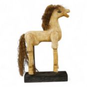 A painted composition articulated model horse, on stand, 42cm