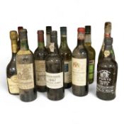 Eleven various bottles of port and wine to include; Cockburns 1997, Chateau Malescot St Exupéry