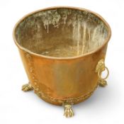 A copper log bucket with paw feet and lion-mask handles, 43cm in diameter