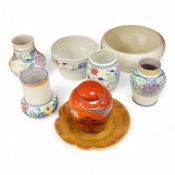 A collection of eight Poole pottery pieces to include vases, bowls and a jar and cover, largest 28cm