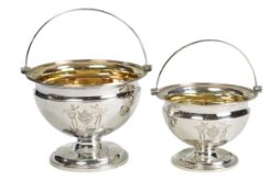 Two George III graduated silver pedestal sugar baskets, by James Darquits