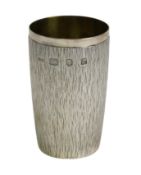 An Elizabeth II bark effect textured silver beaker by Adrian Gerald Benney