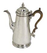 A mid 18th century silver coffee pot, marks very rubbed