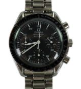 A gentleman's late 1990's stainless steel Omega Speedmaster automatic wrist watch, with box and thre