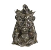 A rare Victorian novelty cast silver mustard pot, modelled as seated cross-legged Mr. Punch, holding