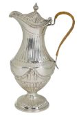 A George III neo-classical silver pedestal hot water pot, by Augustin Le Sage, engraved with the cre