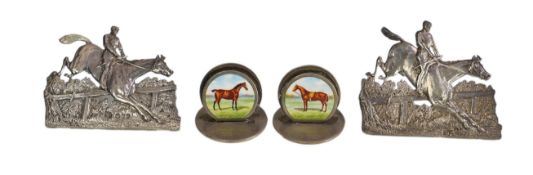 A pair of late Victorian silver menu holders, each modelled as a horse and rider leaping a fence, by