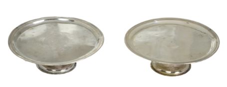 A pair of early late George I/early George II provincial silver patens, by John Elston Jnr