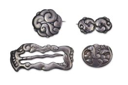 An Arts & Crafts silver slide and three silver brooches, probably Denmark, first half 20th century