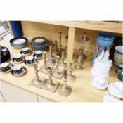 A collection of 19th century and later brass candlesticks, largest 33cm high