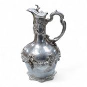 A continental white metal (stamped 0.925) ewer, decorated with floral garlands, height 28cm, 25.