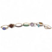 Seven gem-set rings, comprising: a faceted opal and diamond ring; a kunzite and colourless paste