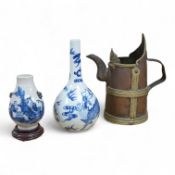 A Chinese blue and white bottle vase, a crackle glaze vase and a Tibetan copper and brass ‘monk’