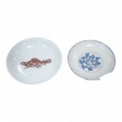 A Chinese underglaze copper red ‘fish’ dish and a blue and white dish, Zhengde mark but later,