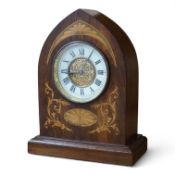 An Edwardian inlaid mahogany lancet shaped eight day mantel timepiece, with key, 23cm high