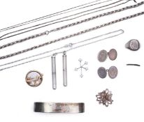 A collection of silver jewels, comprising: a bangle; a chain necklace suspending two winding