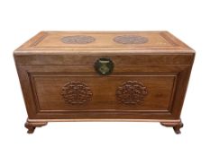 A Chinese carved camphor wood trunk, width 100cm, depth 54cm, height 59cm