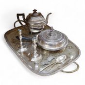 A pair of white metal candlesticks, a silver plated teapot circular tureen and cover spoons and