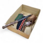 A 1907 bayonet in its scabbard with the tip of the blade shortened, together with a Glengarry cap of