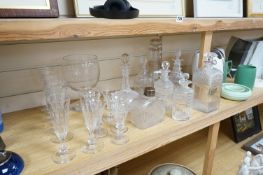 A collection of assorted drinking glassware including sets of decanters and a large etched glass