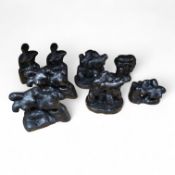 Three pairs of small black figural abstract sculptures, together with two similar sculptures. (8).