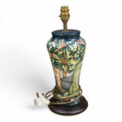A Moorcroft lamp base decorated in the Holly Hatch pattern, 37cm high including the fitting