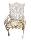 A Victorian Coalbrookdale style painted cast iron garden elbow chair, width 46cm, depth 38cm, height