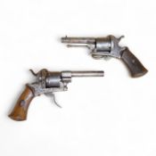 A six shot 7mm Belgian pinfire revolver and another similar, both with folding triggers and wooden