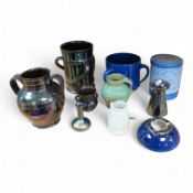 A collection of pottery to include lustre glazed jugs and tygs, a T. G. Green storage jar,