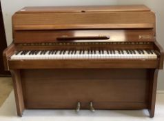 A 1960’s Royalette mahogany cased mini piano, with seven octaves, width 128cm, height 100cm