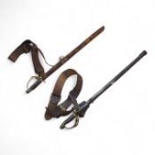 Two early 20th century Imperial German child’s swords with leather scabbards and hangers, blades