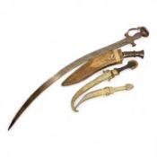An Indian sword tulwar, the iron hilt with traces of chiselled and inlaid decoration, together