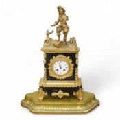 A 19th century French gilt metal mantel clock on stand, with a figural surmount, 56cm total